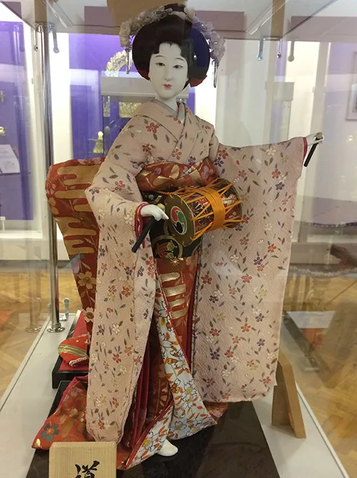 Japanese doll wearing traditional clothing