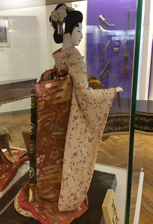 Japanese doll wearing traditional clothing