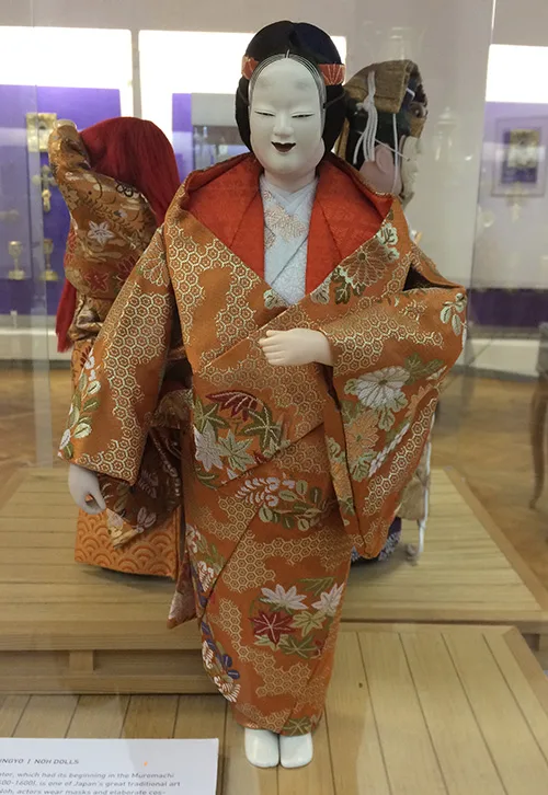 Japanese doll wearing traditional clothing