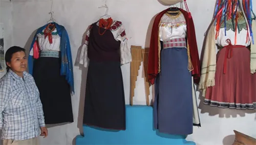 Traditional Quechua belts are used not only for beauty. Cotacachi, Ecuador