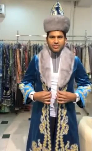 Trying Kazakh traditional attire on for the first time. Honest reviews
