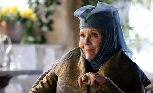 Stage costumes of Olenna Tyrell from Game of Thrones. She’s got charming pillbox hats with wimples