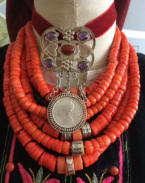 Gorgeous jewelry set coral necklace with silver decorations and silver dukach adorned with gems