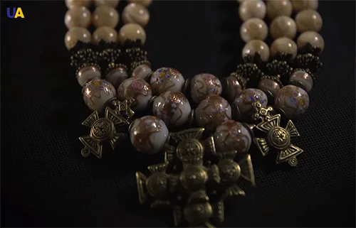 Ornate necklace of mother-of-pearl beads balamuty Venetian glass beads and brass beads and crosses Roksolyana Shymchuk Ethno-gallery