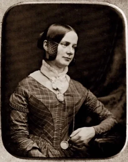 Girl wearing white chemisette holding long watch on chain 1845