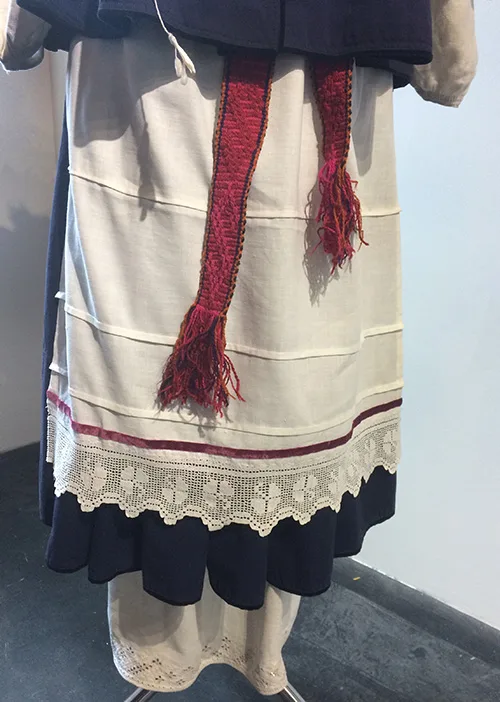 Gorgeous authentic wedding outfit complemented with modern bridal wreath from Ukraine