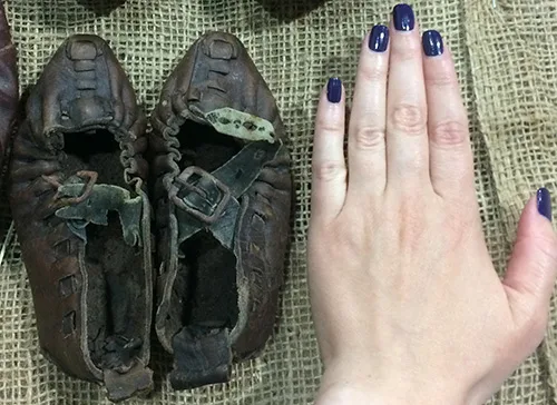 Two pairs of adult shoes next to a pair of kid shoes called postoly. Central Ukraine, the late 19th – early 20th century