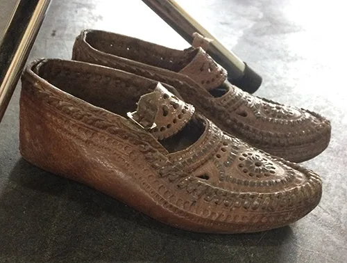 Female leather shoes from western Ukraine embellished with cutting and stamping on leather