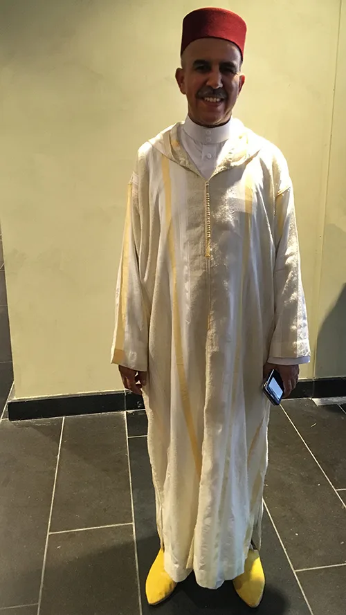 Folk dress of Morocco. Silks, gems, and gold for women, simple elegance for men
