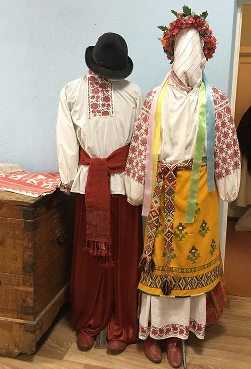 Authentic clothing from northern Ukraine – bast shoes, woven aprons, and floral embroidery