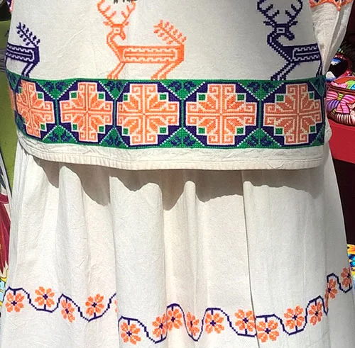 Interesting needlework pattern on Mexican women’s outfit
