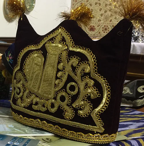 Uzbek headdress embellished with intricate gold embroidery