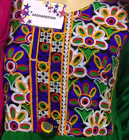 Traditional bridal dress from Afghanistan adorned with multicolored embroidery designs