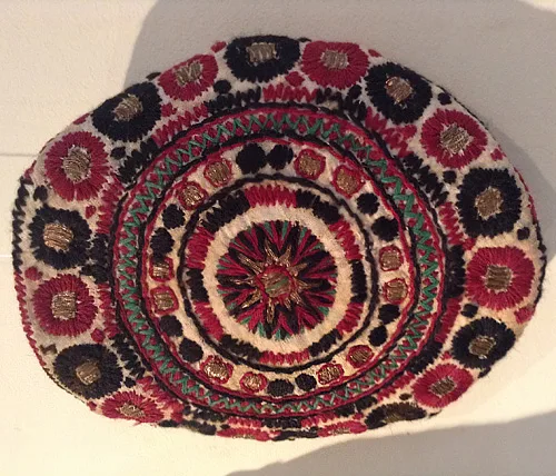 Ukrainian traditional embroidery with woolen and gold threads on women’s coif