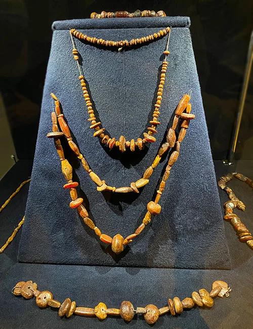 Variety of amber necklaces made from raw amber from burial ground 14th-10th century B.C.