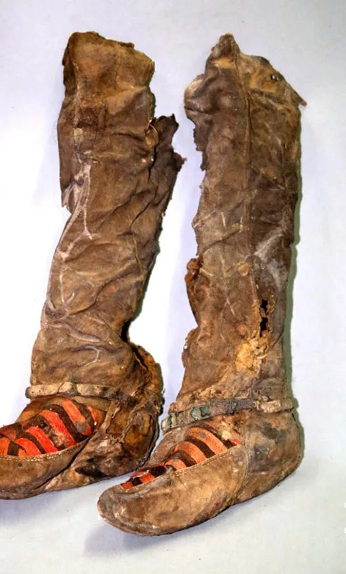 Mongolian millennium-old mummy in Adidas-style shoes. Whaaat?!