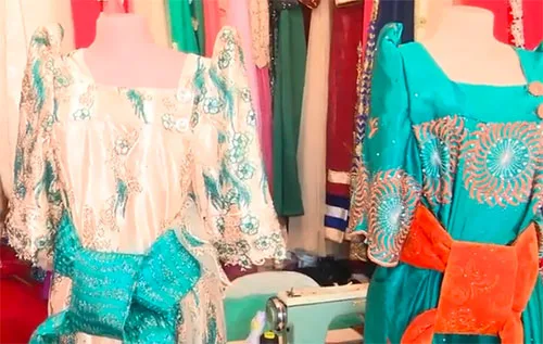 How did schoolgirl uniform turn into traditional dress of Ugandan women