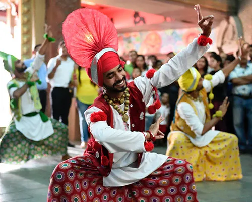 Indian male folk dancers in traditional costumes