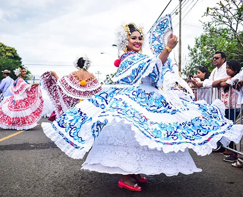 Opulent women’s folk outfit of Panama Gala Pollera and striking amount of sparkly jewelry