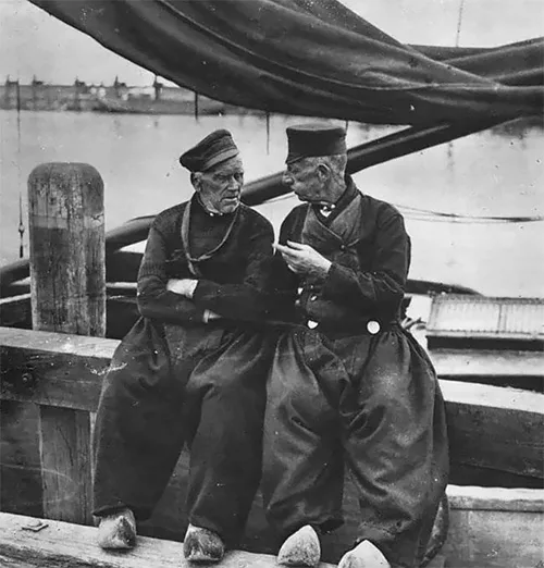 Traditional clothing of the Netherlands. Dutch baggy pants, lace bonnets, and wooden klompen are the trademark of the Netherlands